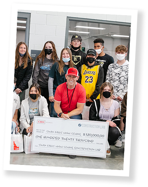 High school class posing with large check