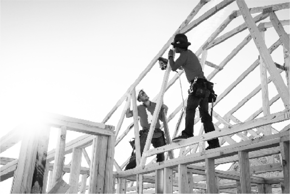 Builders framing a home